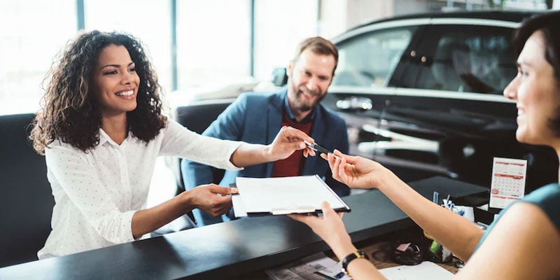 Car shoppers working with dealership financing
