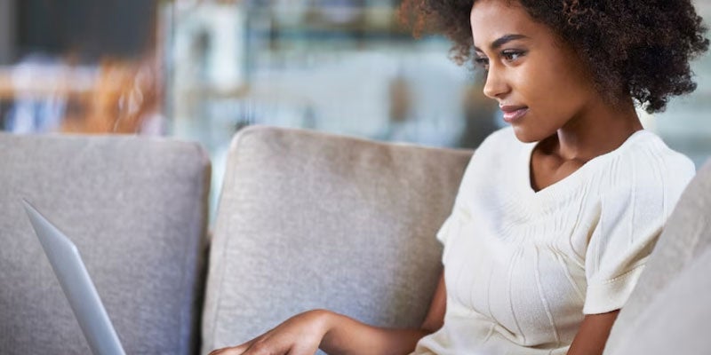 Person car shopping online on their laptop